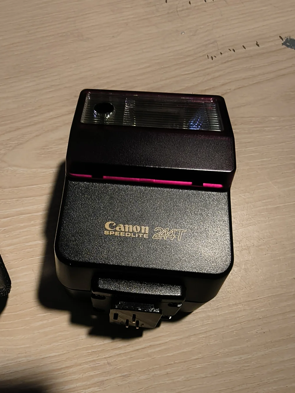 vintage Canon Speedlite 244T electronic flash unit with its leather case,